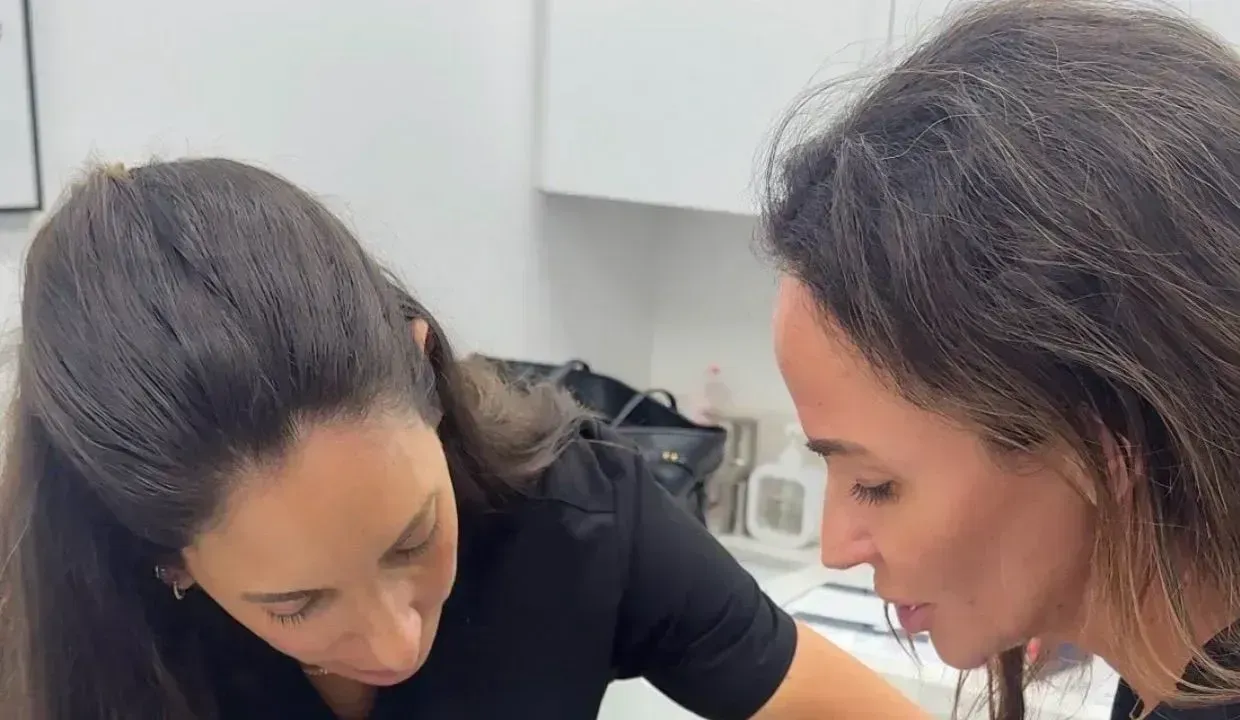 Two injectors learning together during hands-on aesthetic training